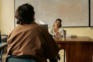 A teacher standing at the front of a classroom